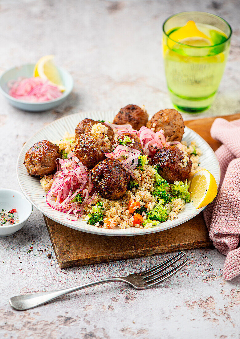 Lamb balls on couscous with vegetables