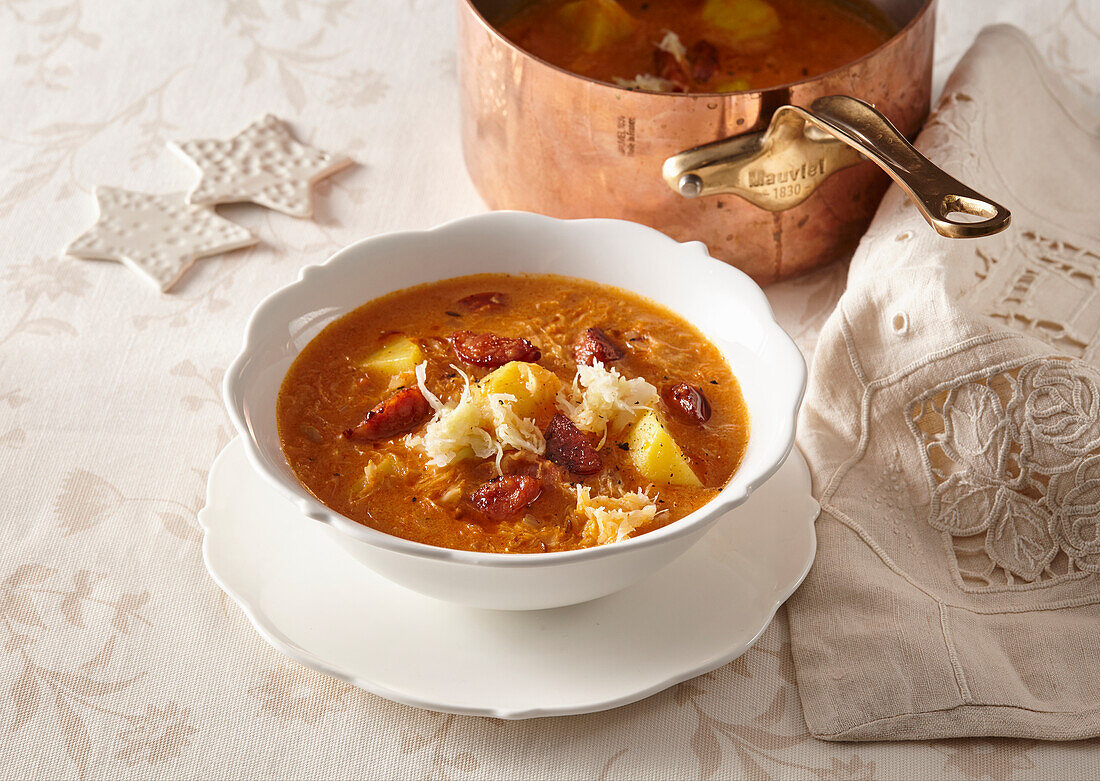 Sauerkraut soup with red pepper sausage