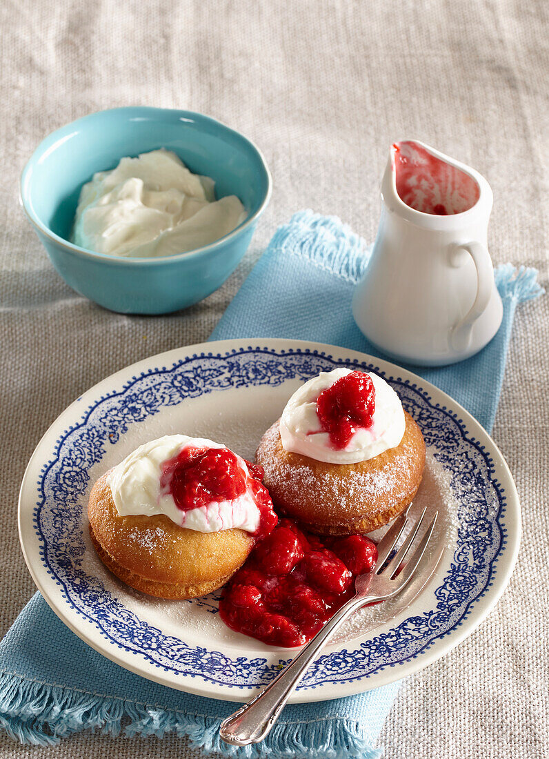 Baked doughnuts with raspberry sauce