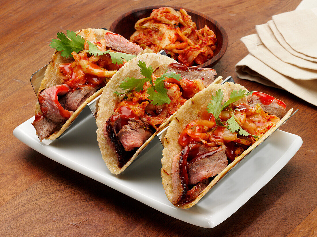 Grilled sirloin steak tacos with onions and cilantro