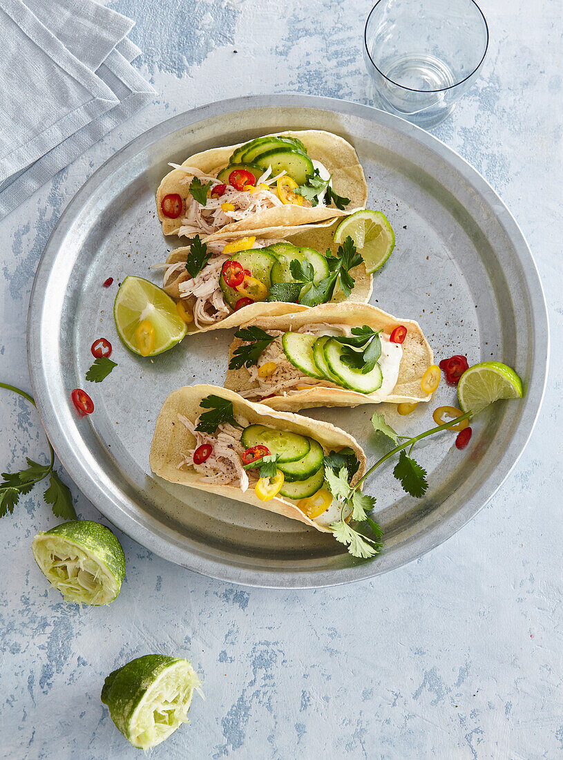 Tacos with chicken, cucumber and chilli