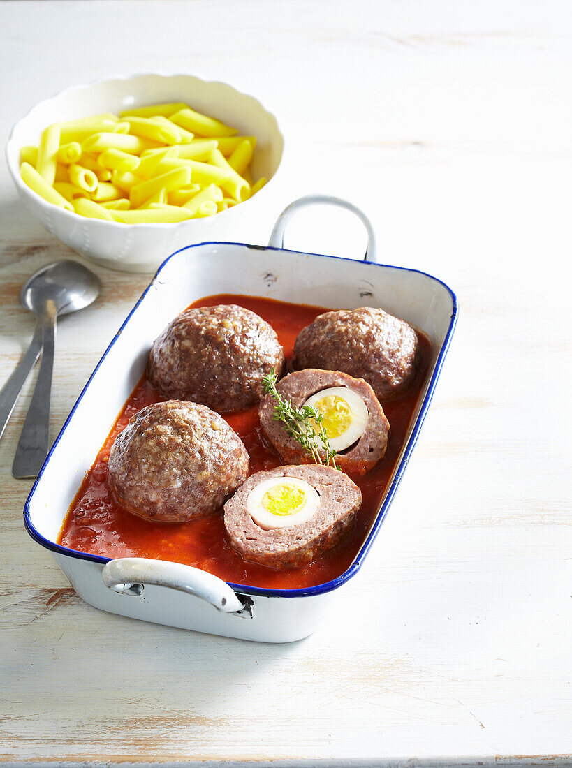 Mince meat balls with egg and tomato sauce