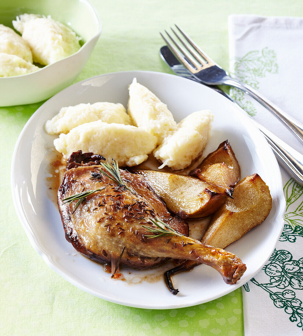 Baked duck legs with pears