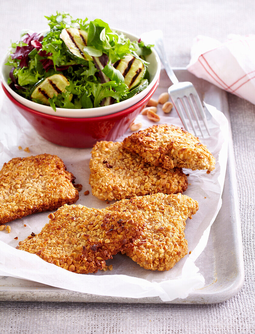 Turkey schnitzel coated in peanuts