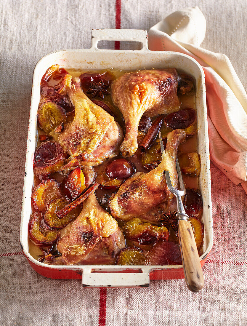 Duck legs on a bed of plums with gingerbread spice