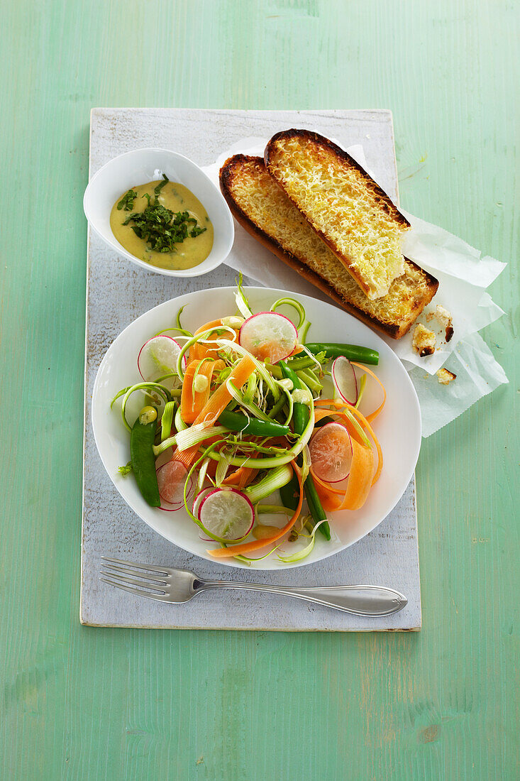 Fresh vegetable salad with cheese baguette