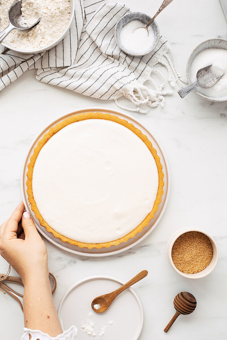 A sponge cake base with cream cheese frosting