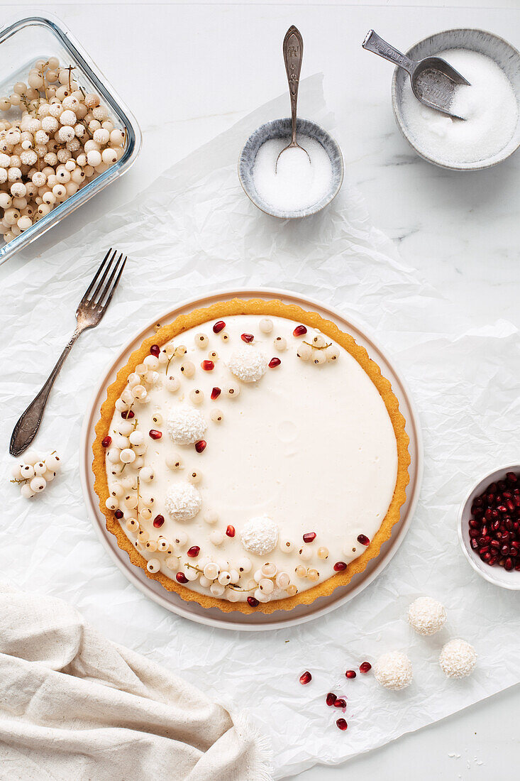 A cream cheese cake with meringue and white currants