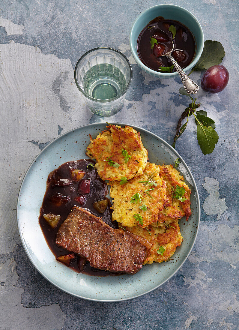 Roast beef with potato pancakes and plum sauce