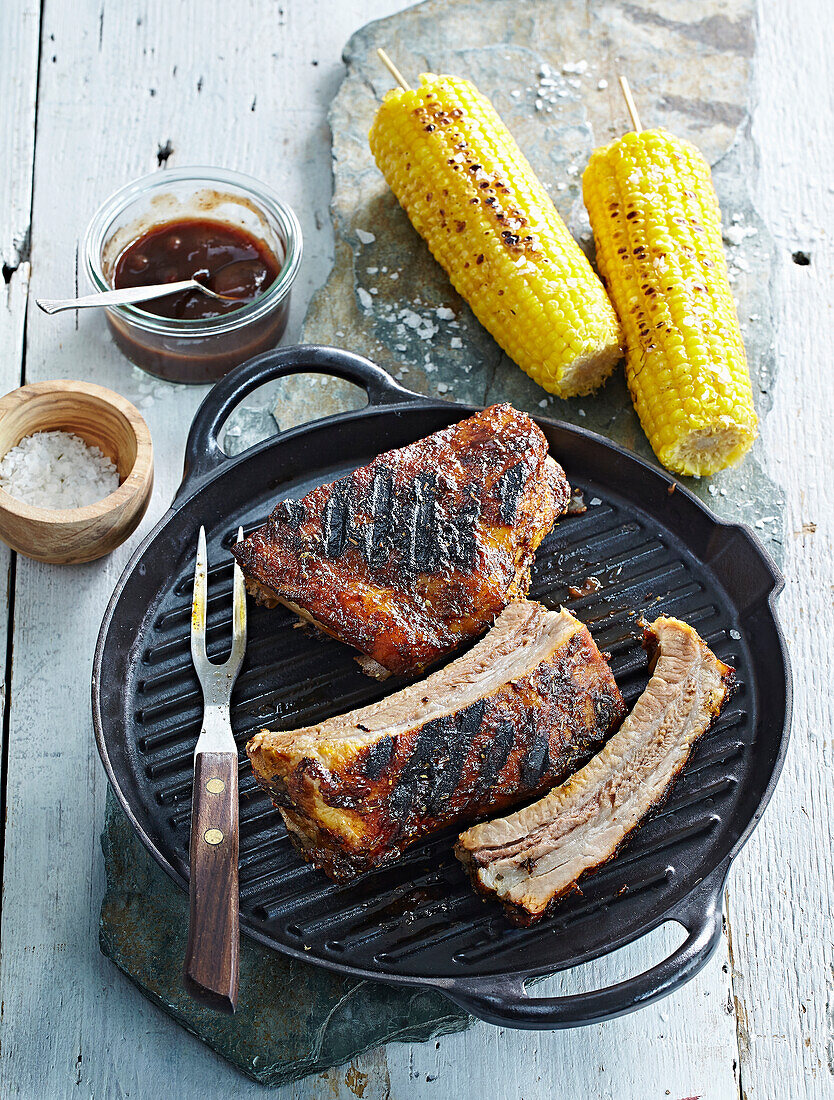 Grilled pork chops with corn cobs