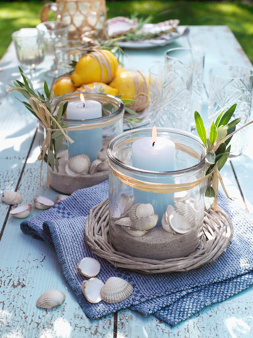 DIY lanterns with mussel shells as table decorations