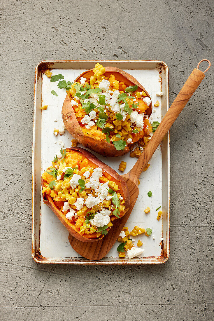 Spicy baked sweet potato with a corn topping