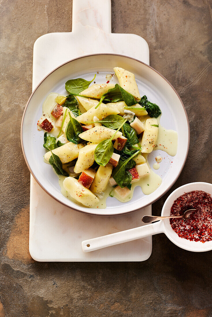 Potato and poppy seed gnocchi with spinach, pear, and blue cheese