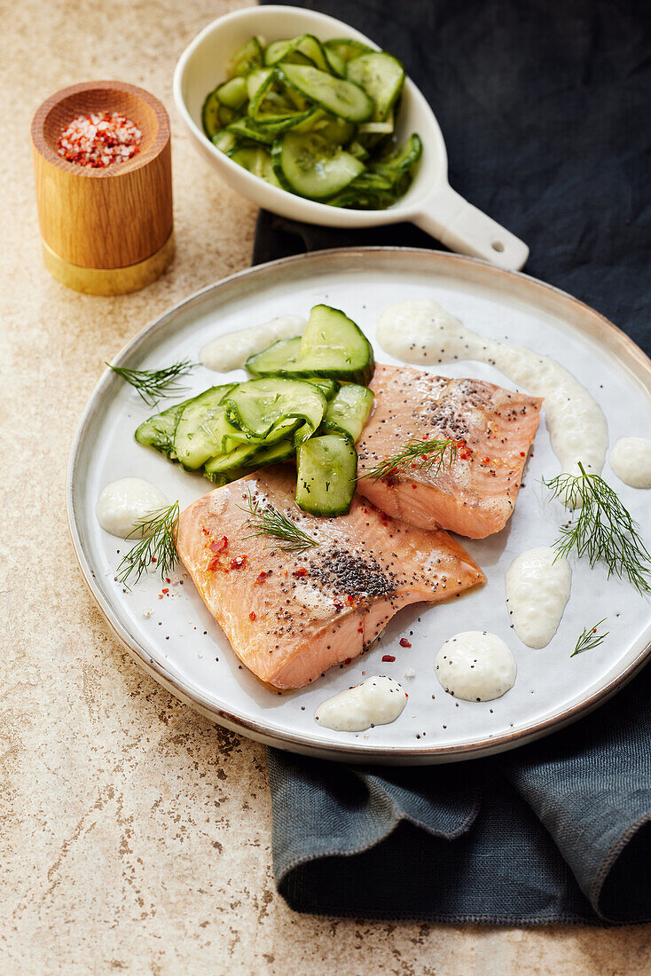 Salmon trout with ginger and poppy seeds with cucumber salad