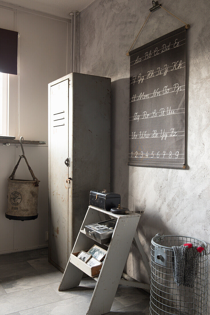 Vintage metal locker and step ladder in corner of room