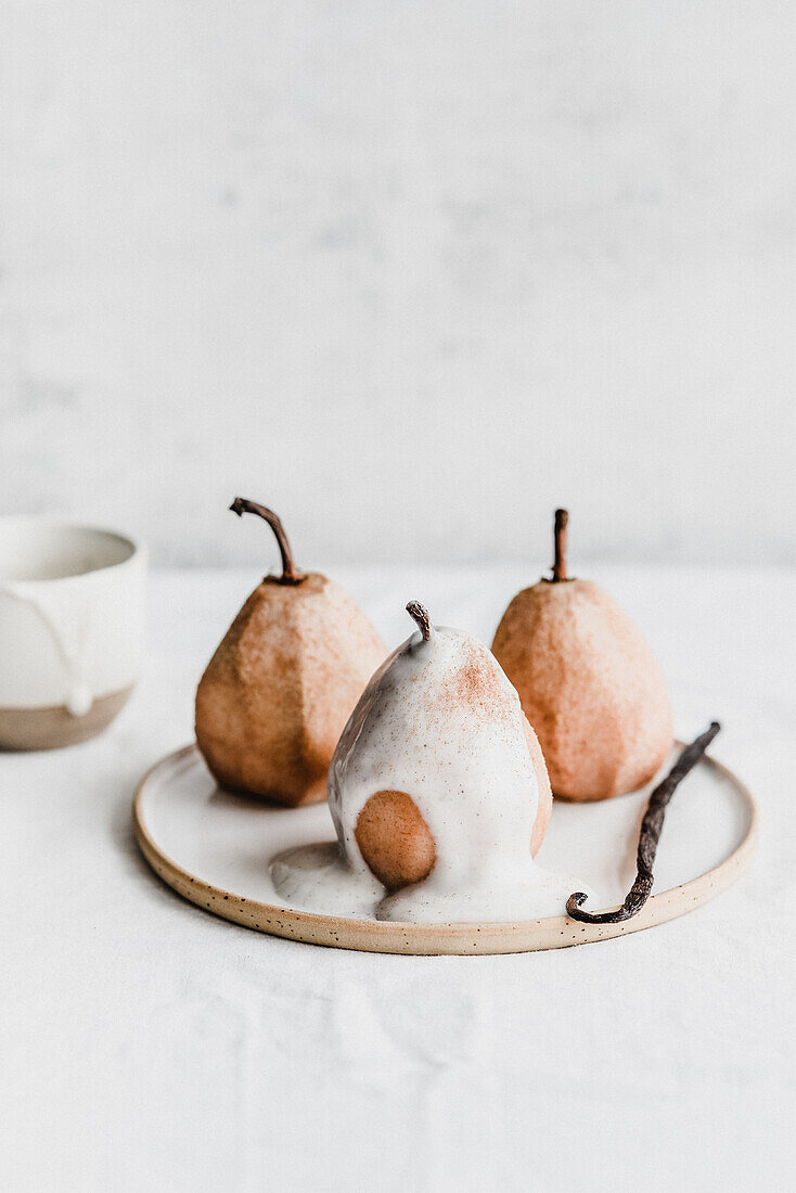 Pears topped with vanilla cream