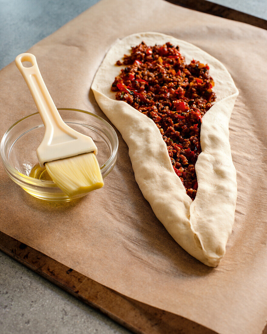 Preparing pita with minced meat filling