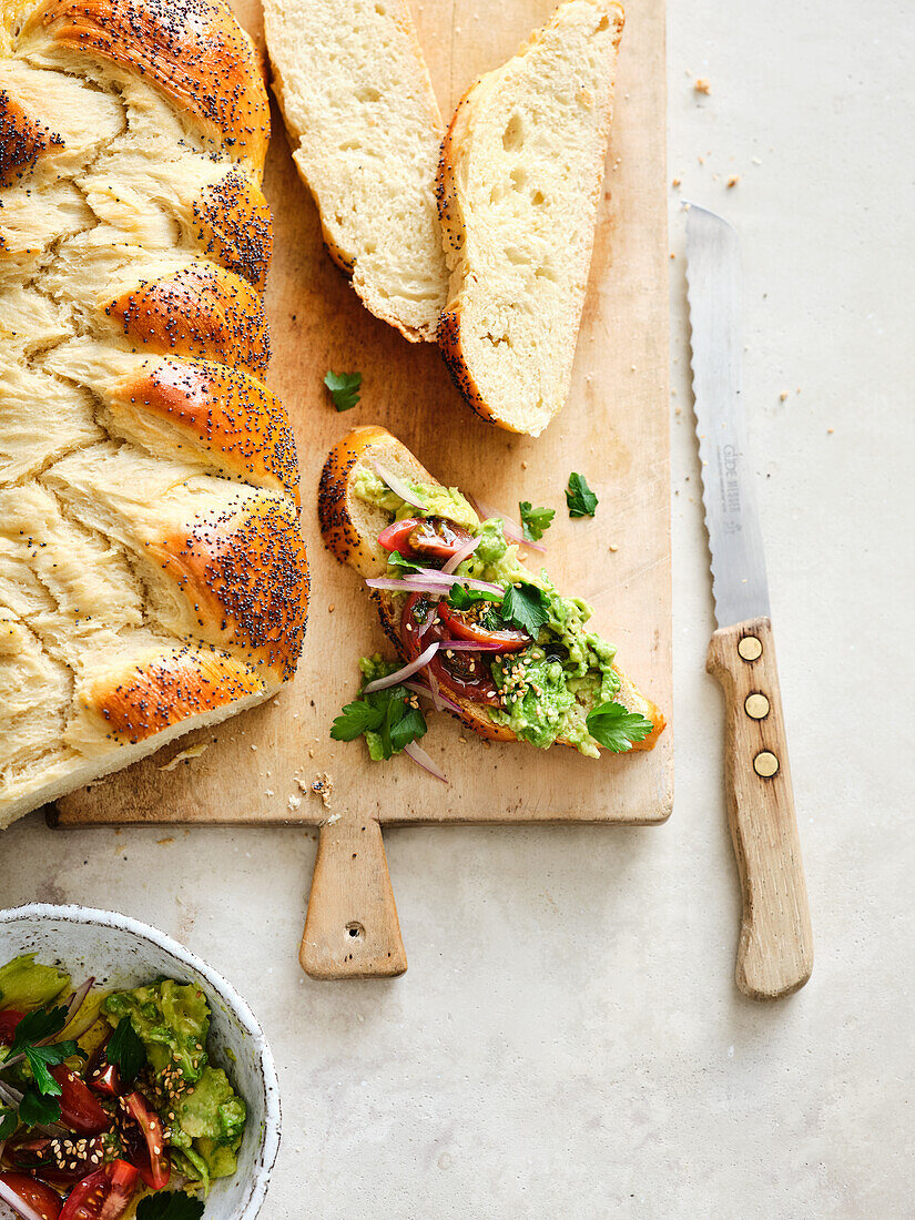 Challah with avocado cream and tomatoes