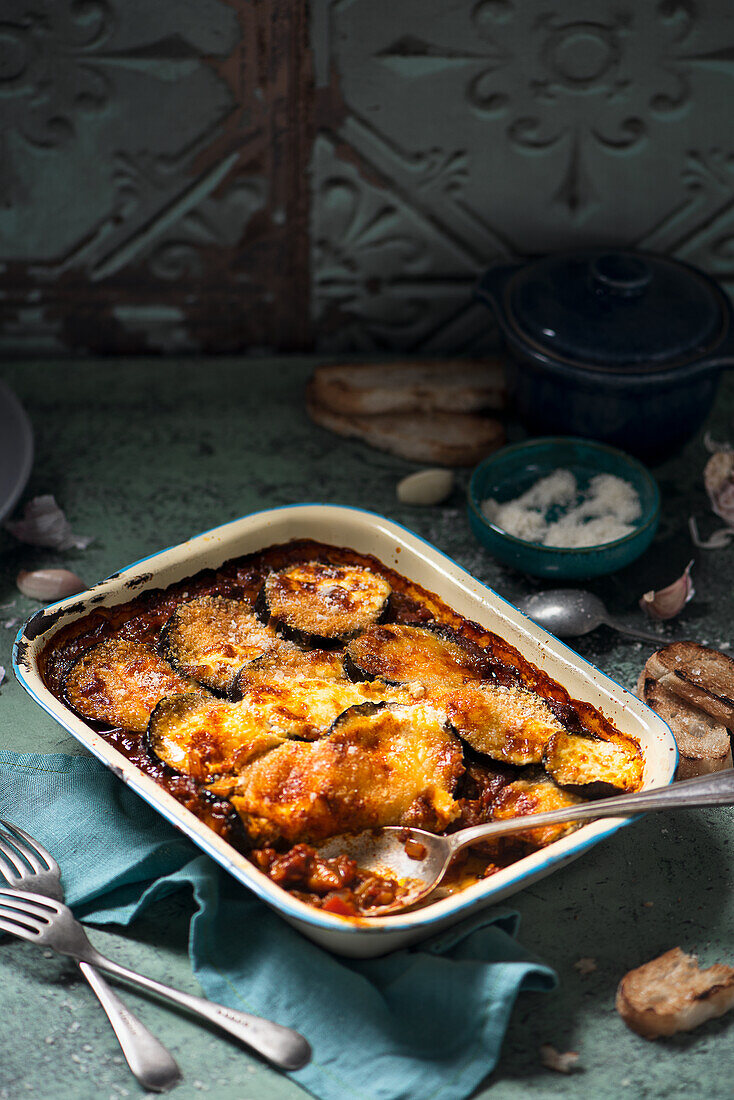 vegeterian moussaka made with tomatoes, lentils, peppers and spices, topped with aubergine, creme fraiche and cheese