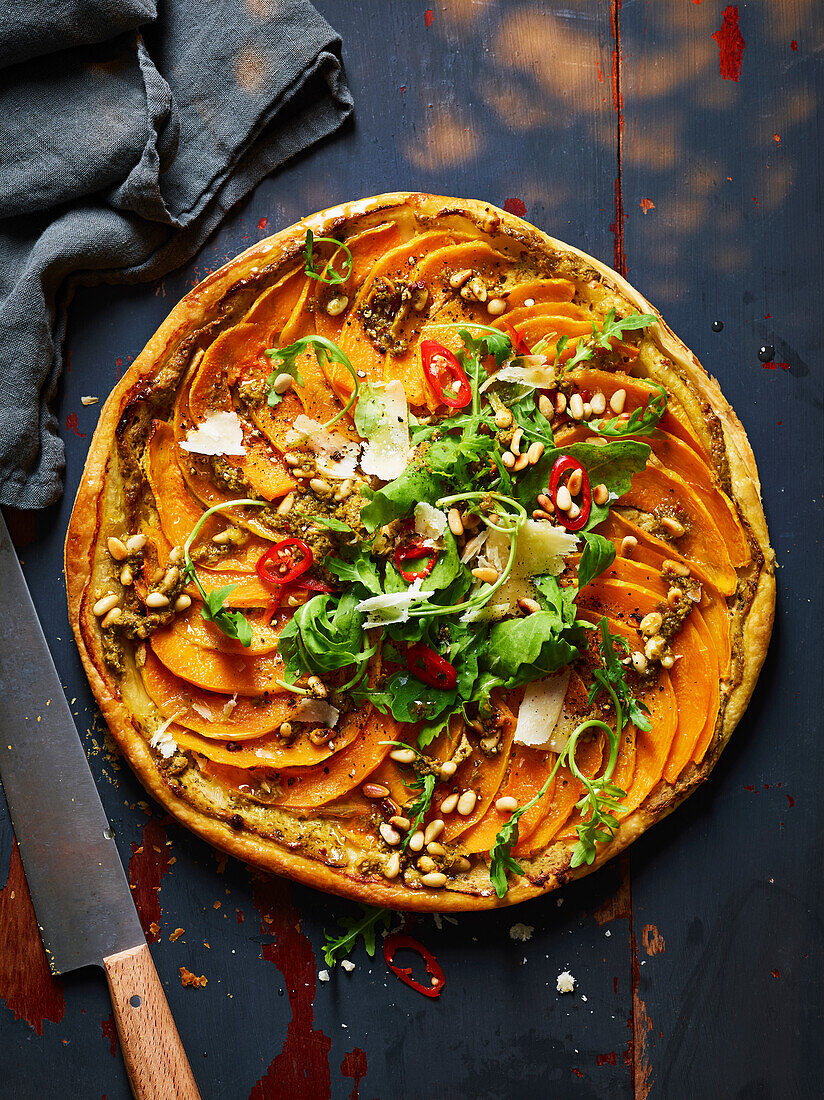 Pumpkin tart with pesto, chilli and pine nuts