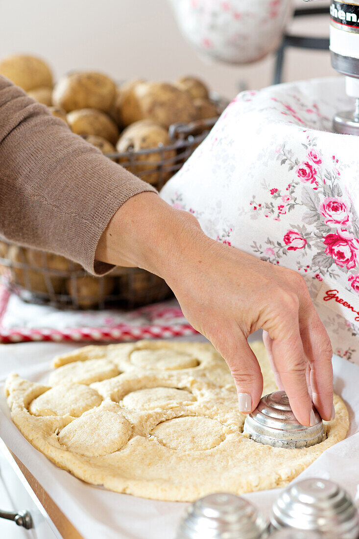 Cutting out scones from potato dough