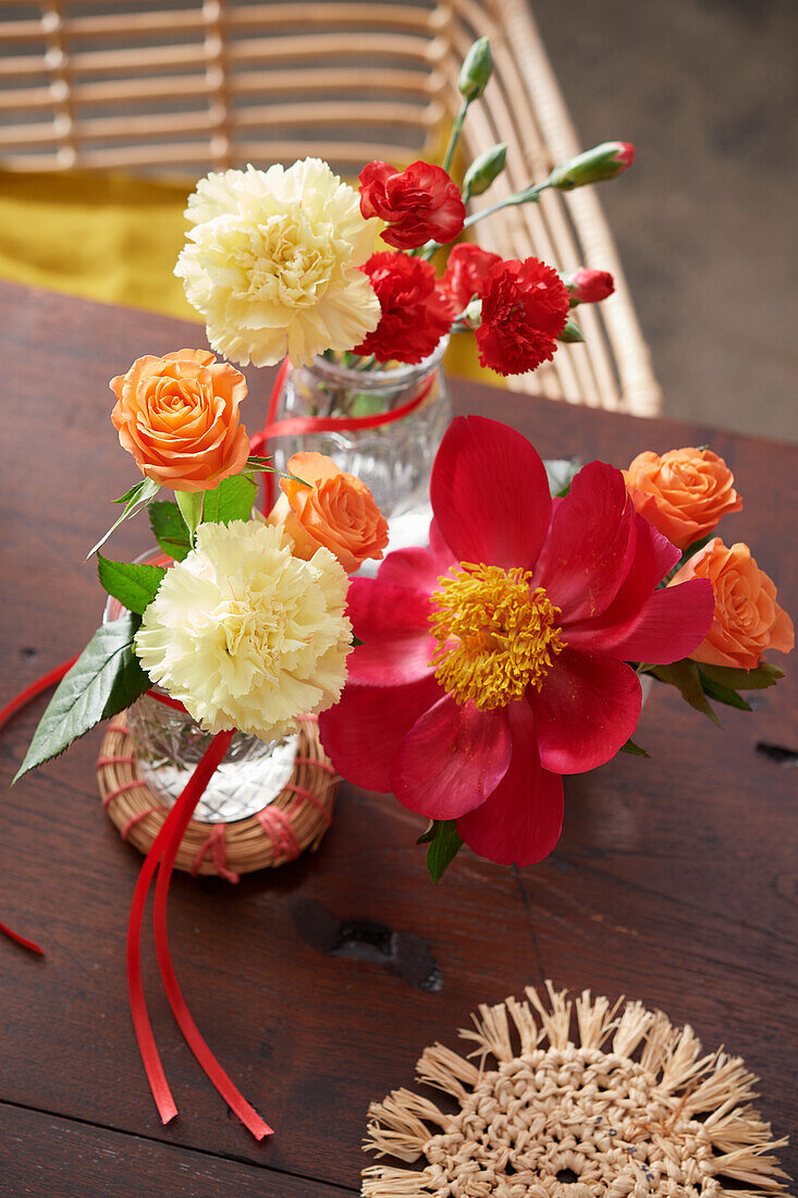 Bright floral decoration with roses, carnations, and peonies