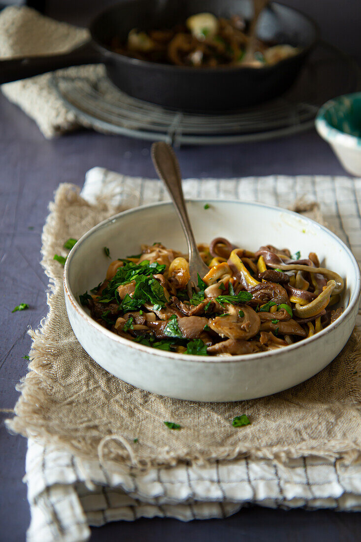 Homemade tagliatelle with mushrooms and parsley