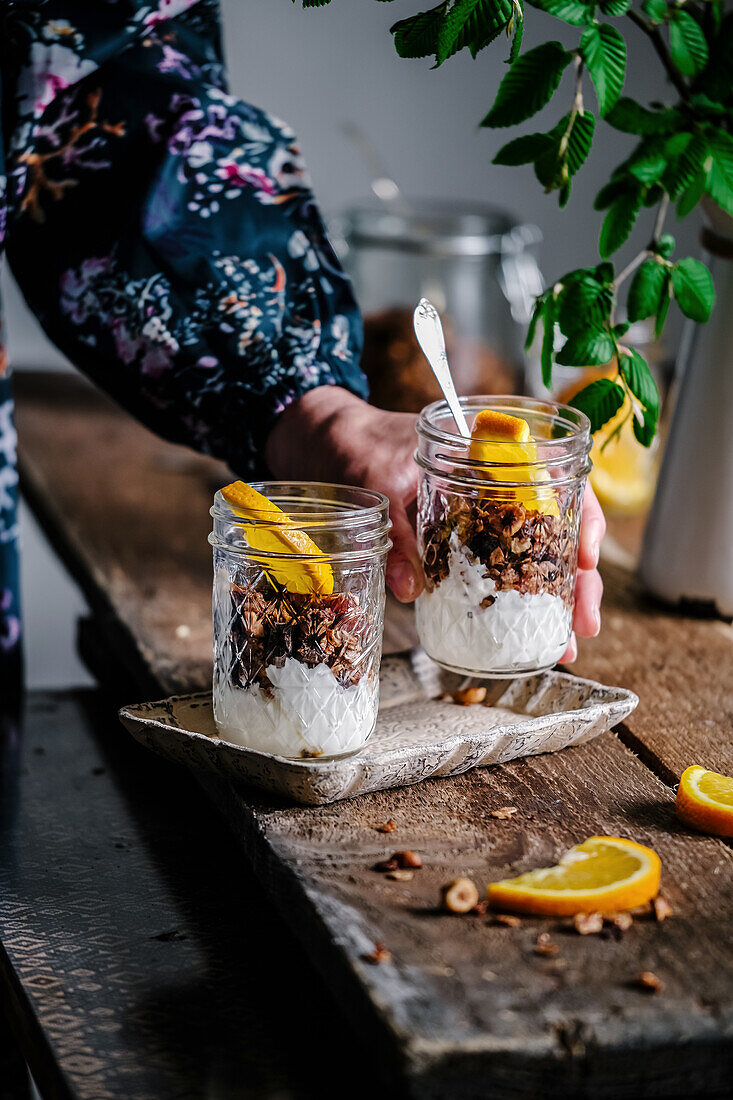 Granola with yoghurt and oranges