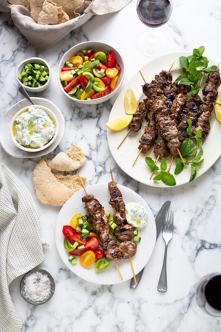 Greek lamb souvlaki with salad and tzatziki