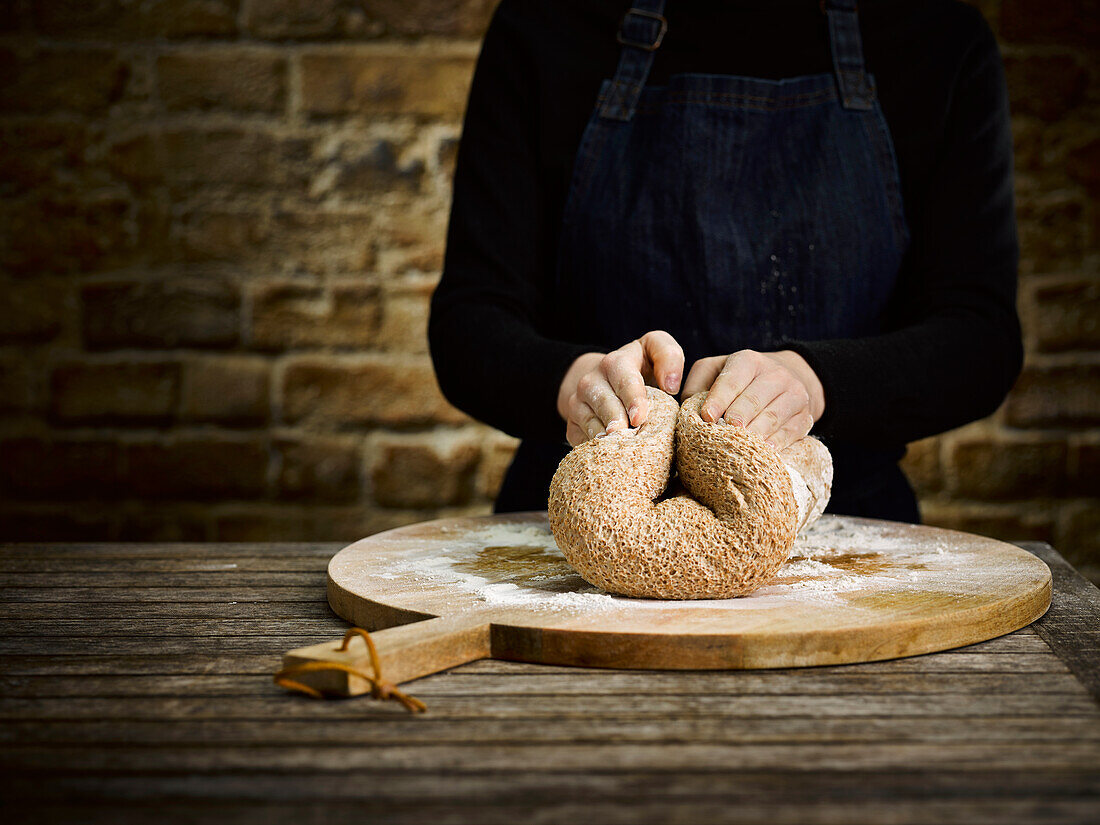 Hands kneading bread dough