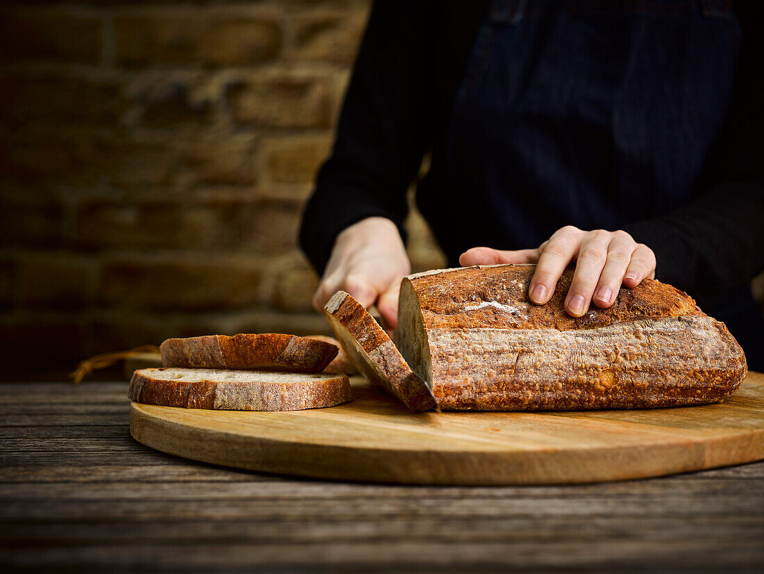 Sourdough bread being sliced