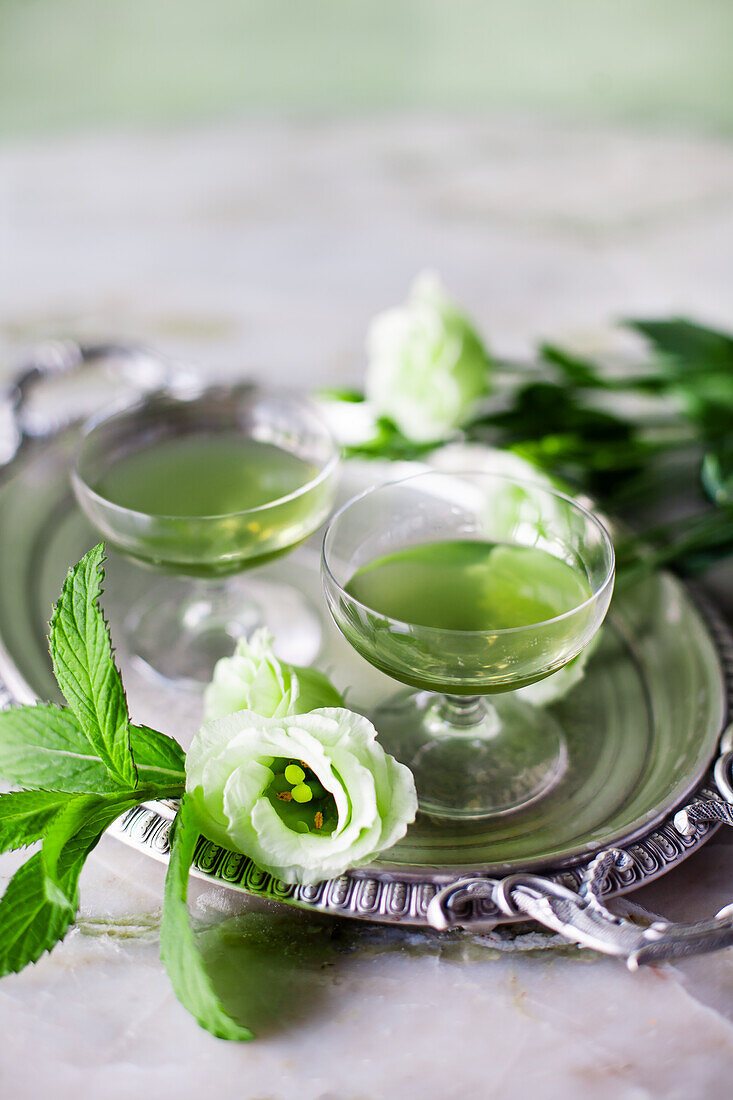 Mint liqueur and rose petals