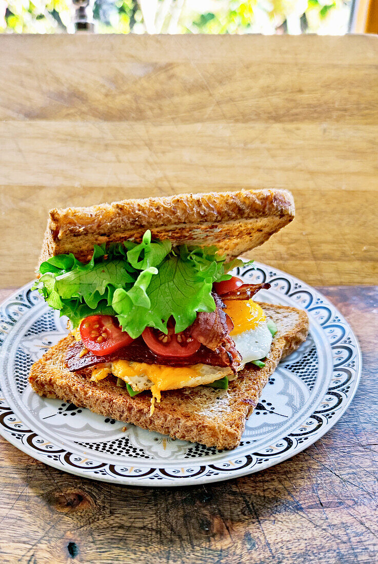 A bacon, tomato and egg sandwich