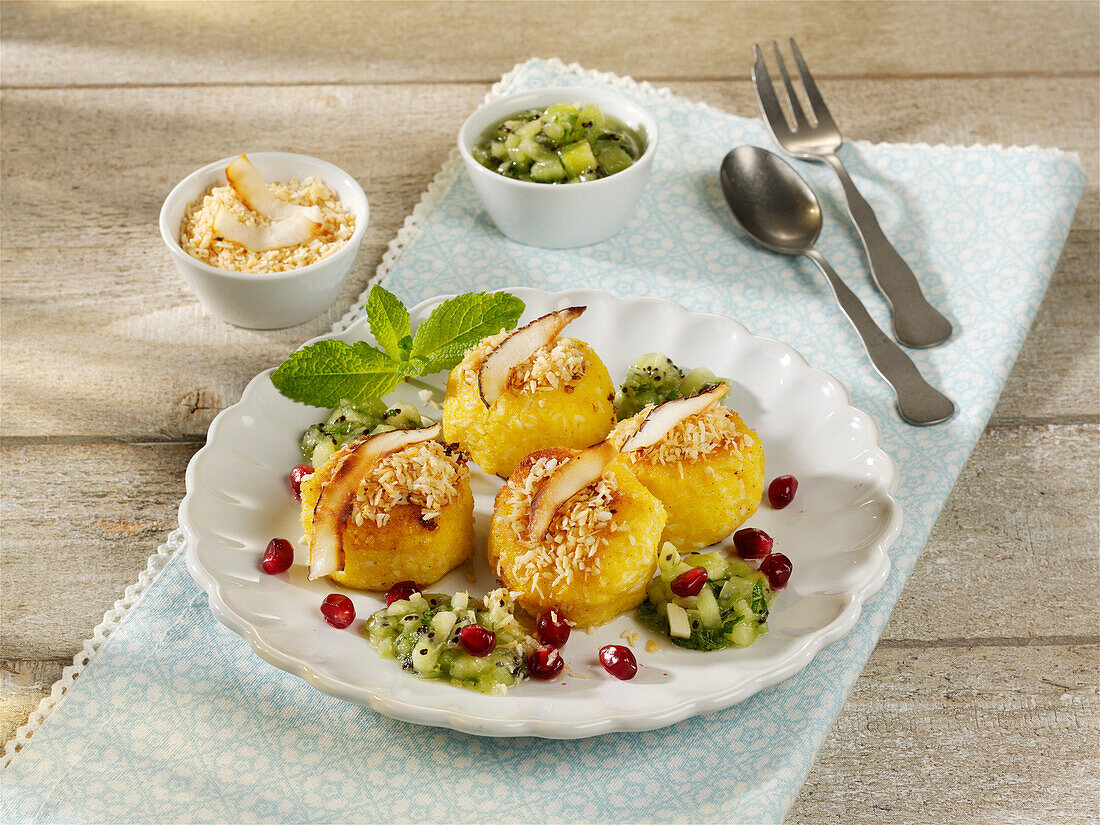 Polenta and coconut dumplings with kiwi and honey salsa