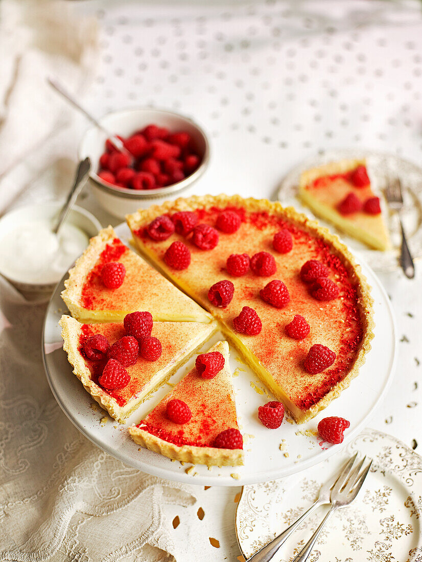 White chocolate and cardamom tart with raspberry dust