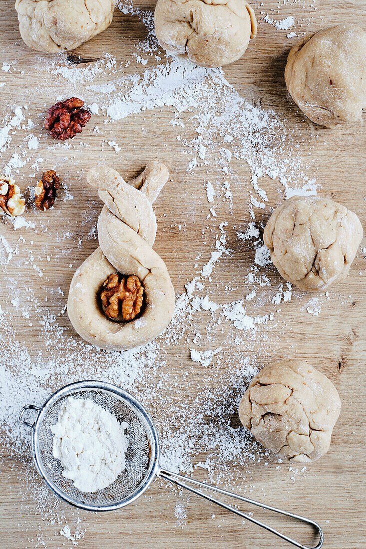 Preparing vegan yeast Easter bunny rolls