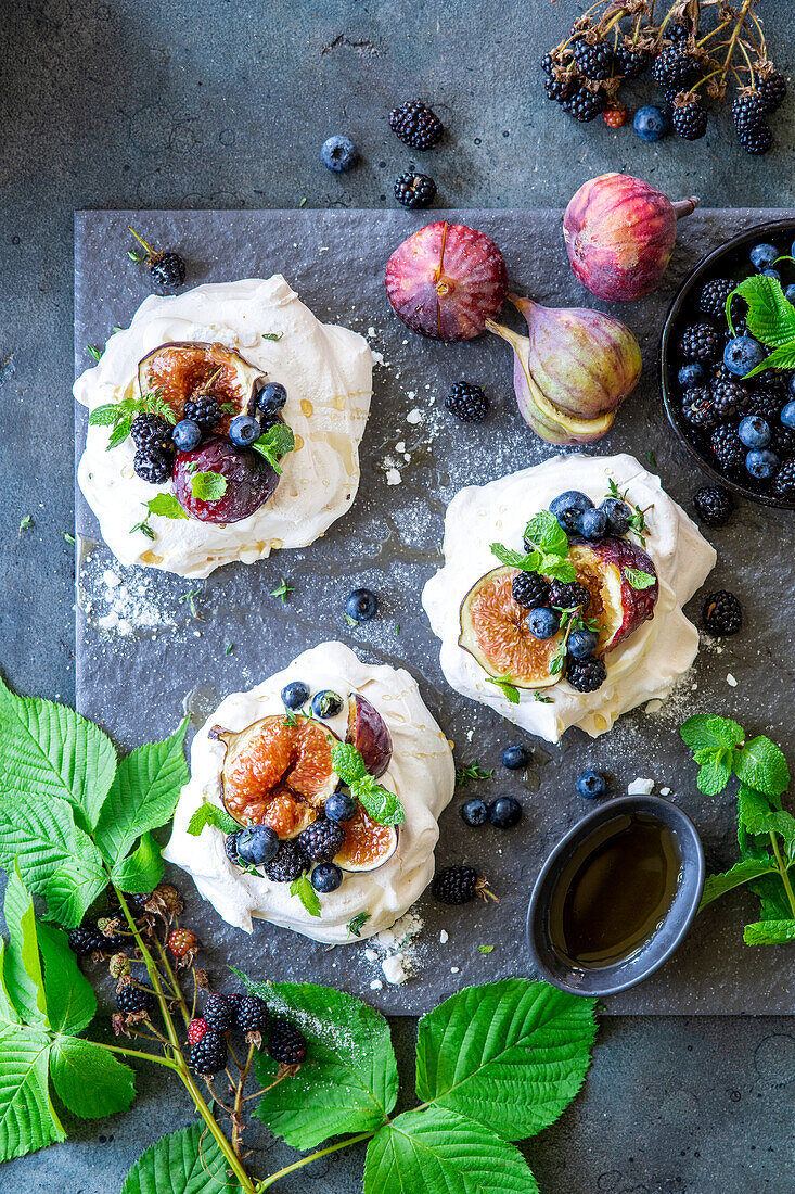 Mini pavlovas with figs, blueberries and blackberries