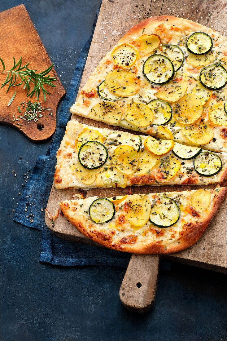 Courgette tarte flambée with potatoes and taleggio