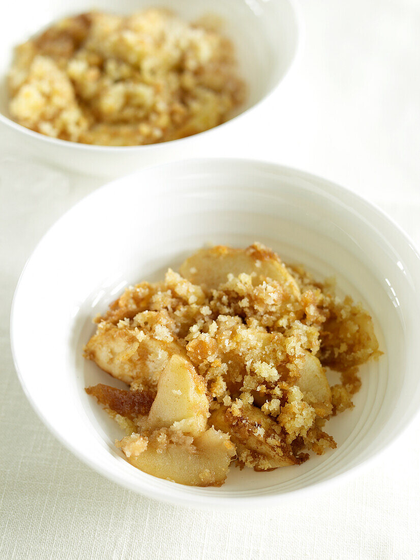 Two bowls of apple brown Betty