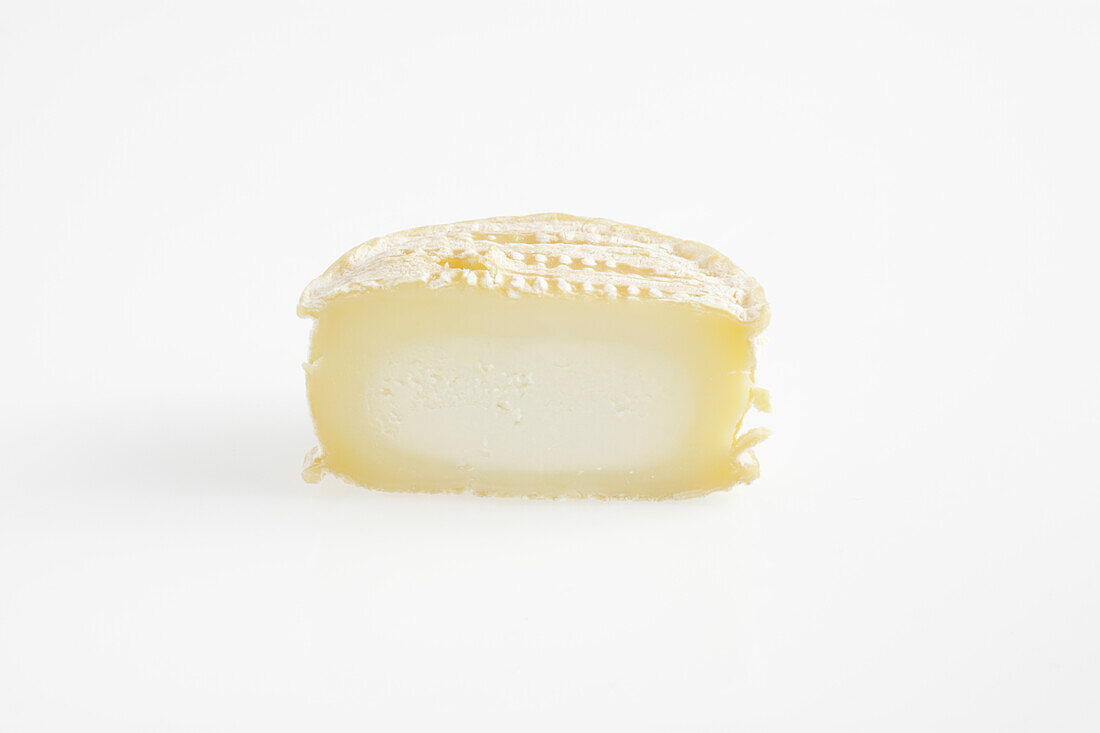Sliced round of French Lou rocaillou ewe's milk cheese
