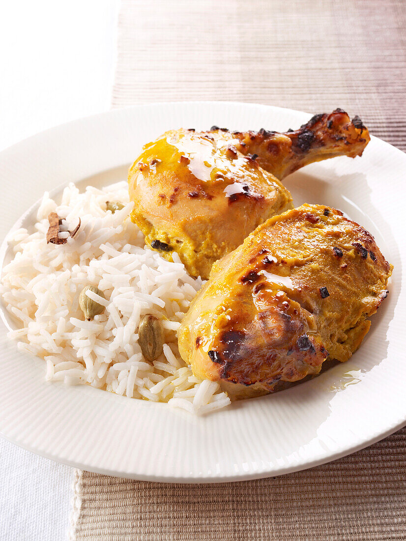 Garlic chicken with rice on plate