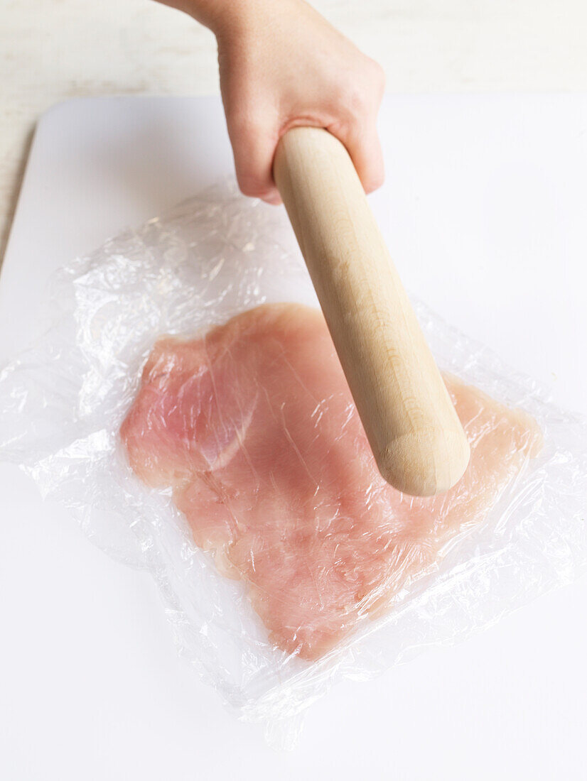 Flattening chicken breast so it is thin and even