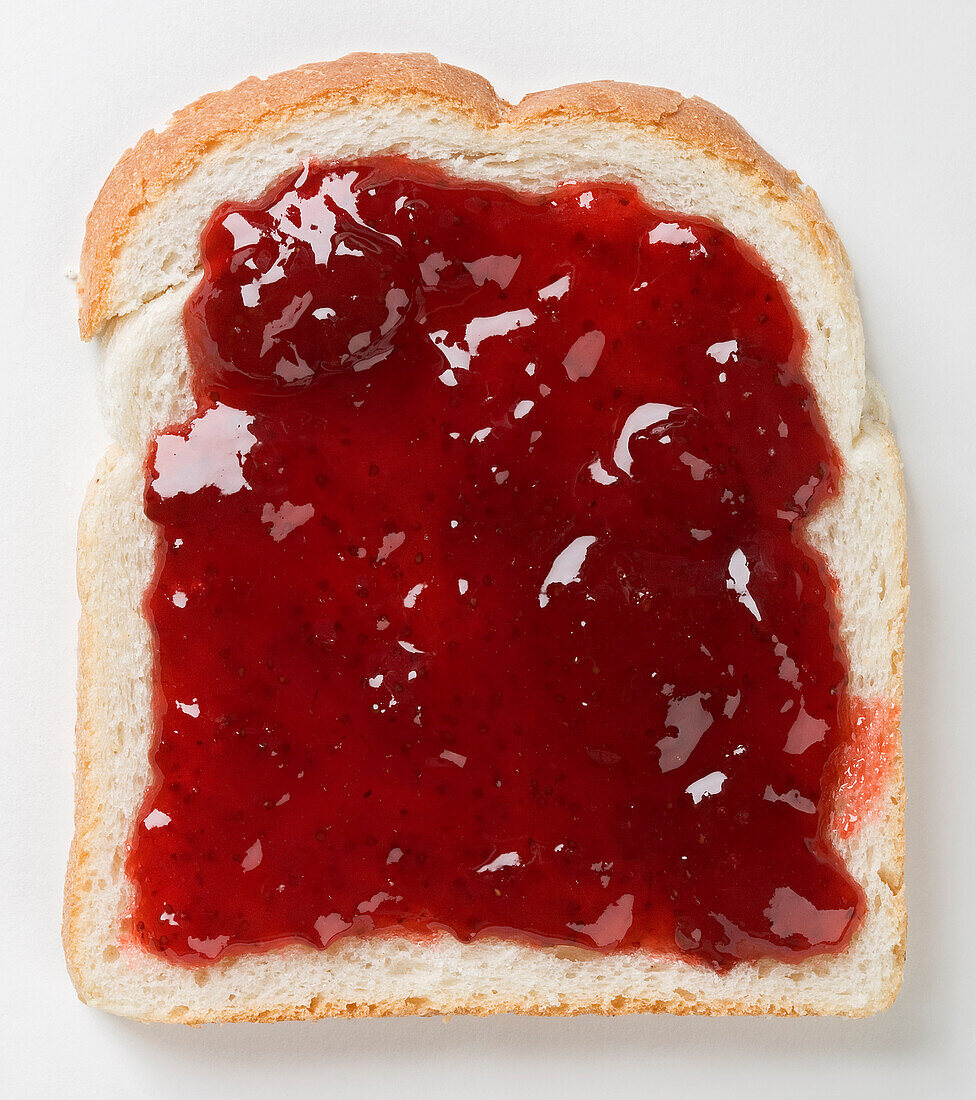 Strawberry jam on white bread