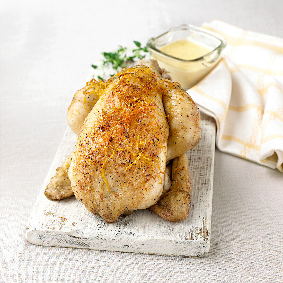 Roasted chicken on chopping board