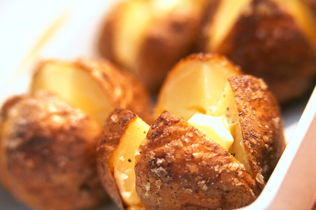 Baked potatoes with knob of melting butter