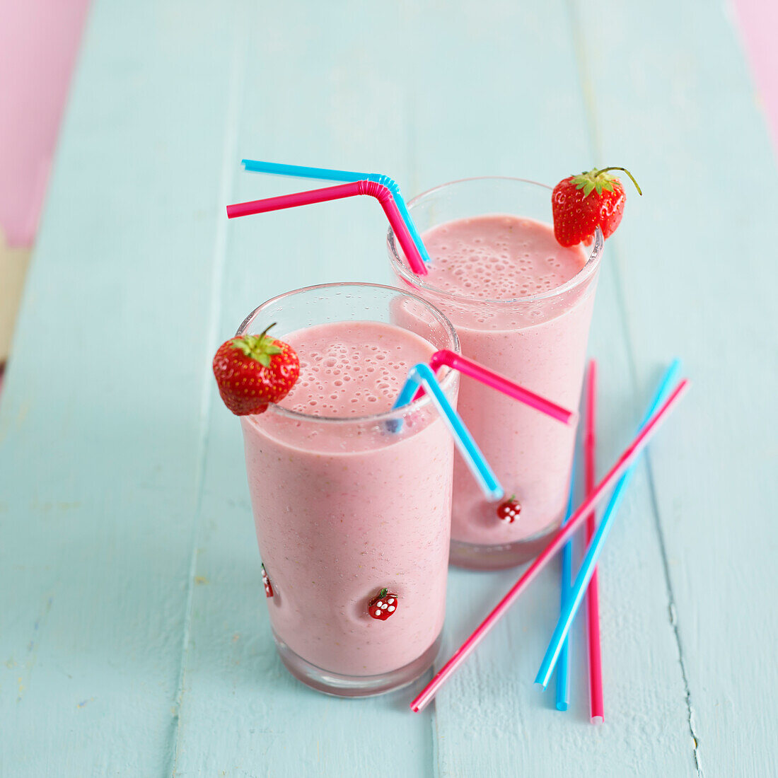 Two glasses of strawberry smoothie