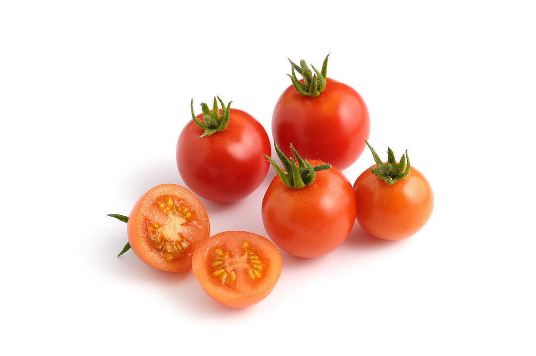 Whole and sliced German tumbler tomatoes