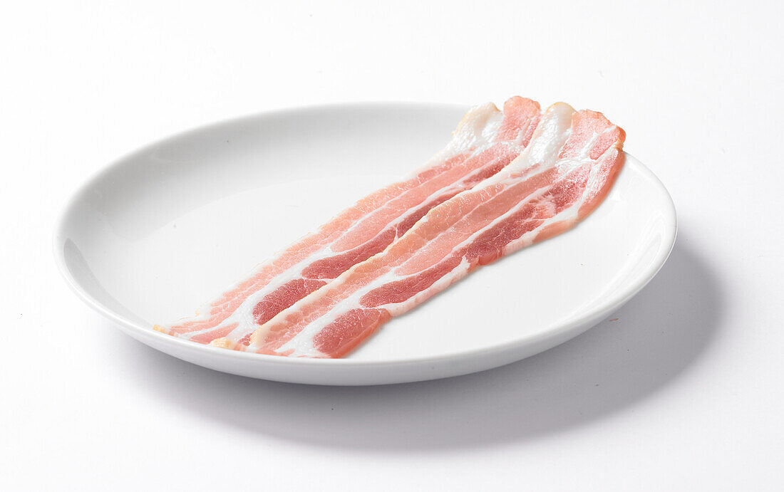 Two strips of bacon on a plate