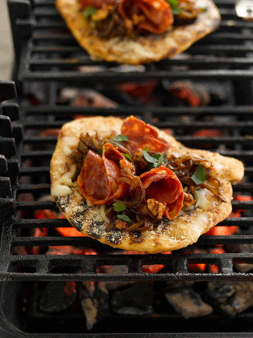 Pizza on charcoal grill