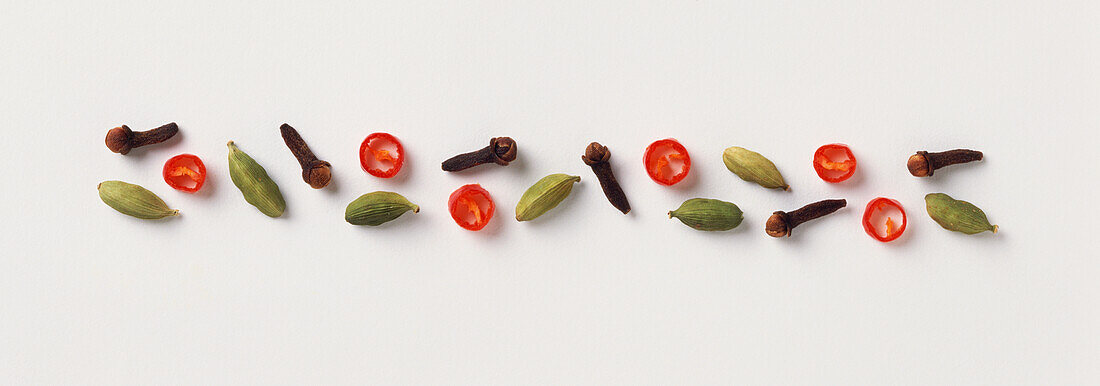 Cloves, cardamon pods and chilli slices